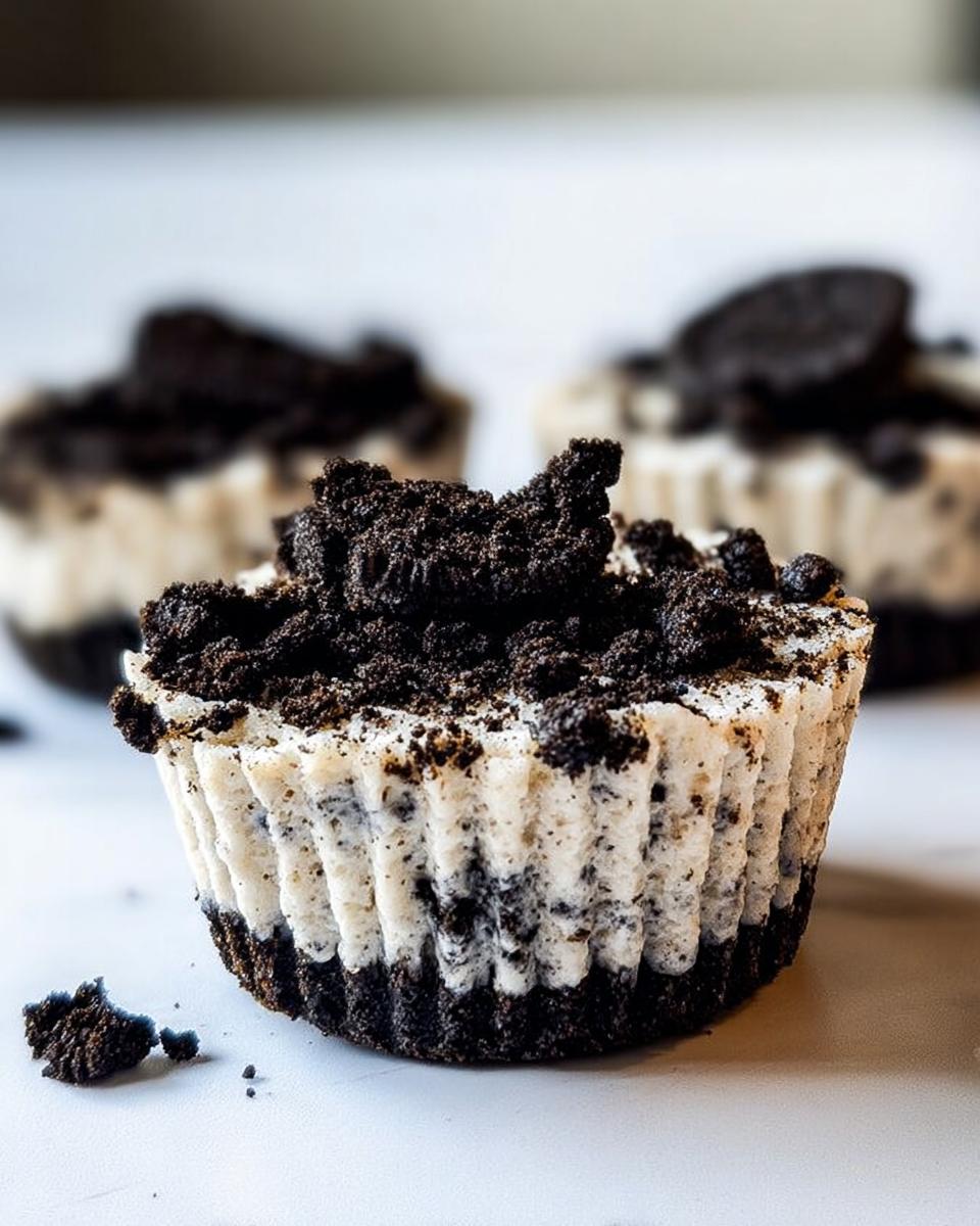 Close-up of a Healthy No-Bake Oreo Cheesecake Bite topped with crushed Oreos and a whole Oreo.