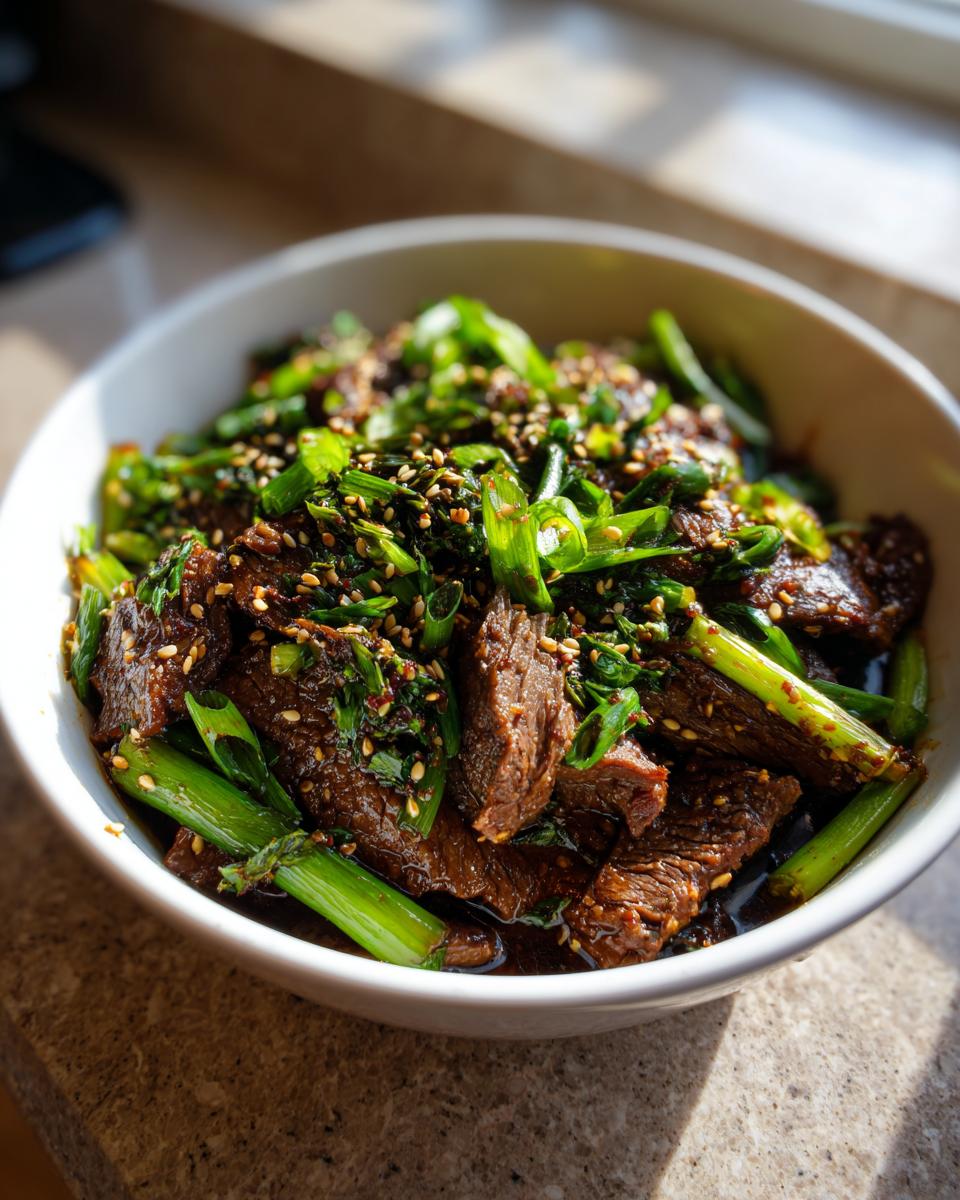 A close-up of tender Korean Style Pot Roast in a white bowl, garnished with chopped green onions and sesame seeds.